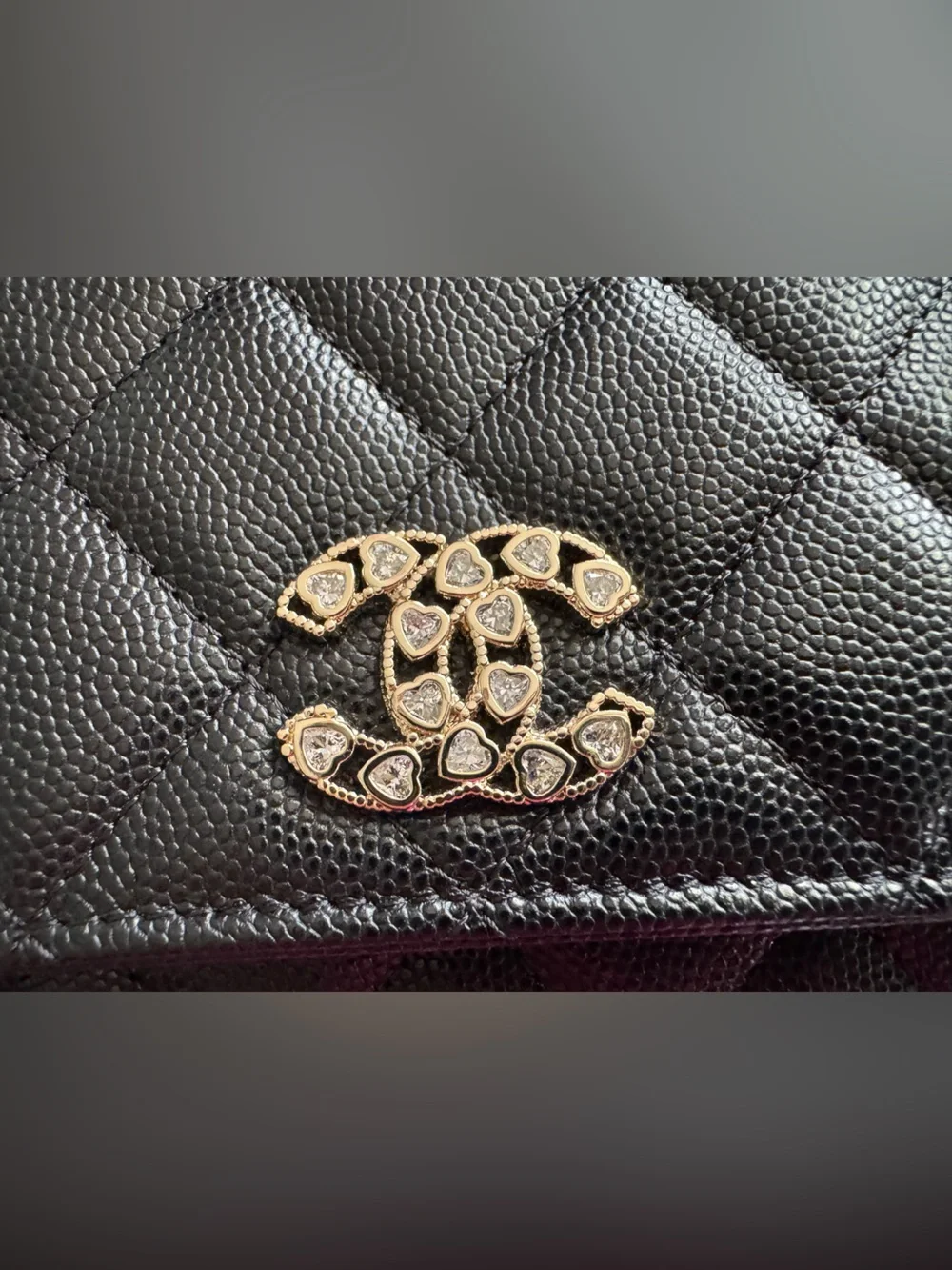 CHANEL WOC Black caviar leather with Gold Hardware and heart shaped crystal logo